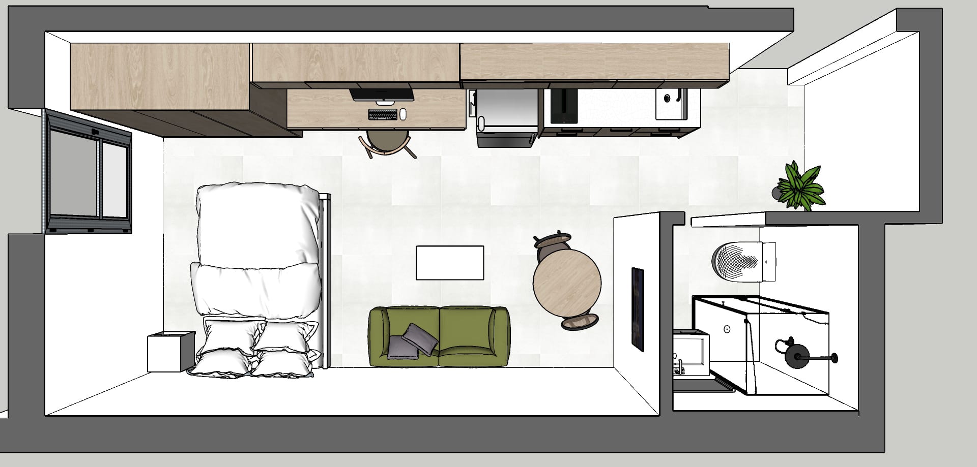 תוכנית על של סטודיו קטן עם מטבח לאורך הקיר העליון, מיטה זוגית בצד שמאל, ספה ירוקה ושולחן עגול במרכז, וחדר אמבטיה מימין.